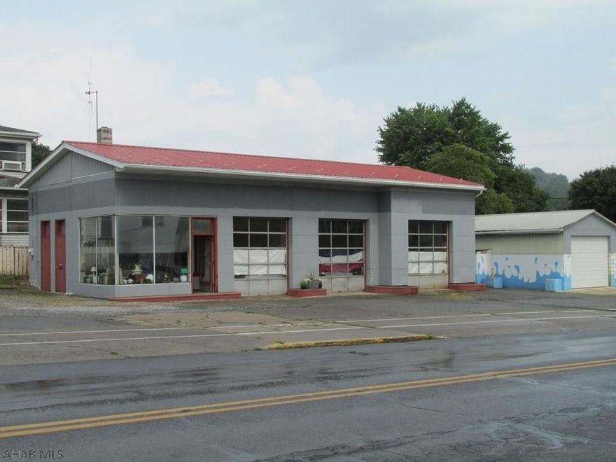 Unlimited potential for this "Town Center" property in Williamsburg Borough. Motivated Seller says "Make Me An Offer"!!  Well maintained building has good mechanics - formerly a service station with underground tanks removed and DEP certifications.  Former car wash has been turned into a storage garage.(pumps remain but all other carwash equipment has been removed.) Square footage, tax info and assessed values as per tax card.  Turn this highly visible corner into your new business location - near Rails to Trails, banks, churches, library, schools, convenience stores.