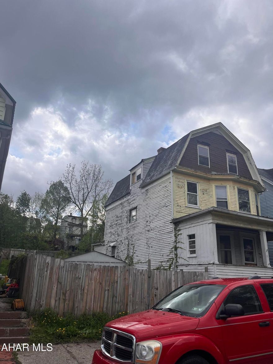 Very large home being sold as is! This would make a great rental property. Needs some work to bring up to speed. Prior tenant beat it up a bit. Large fenced yard could be adjusted to make off street parking off of alley. Shed included. 2 large rooms on 3rd floor if you need extra living space.