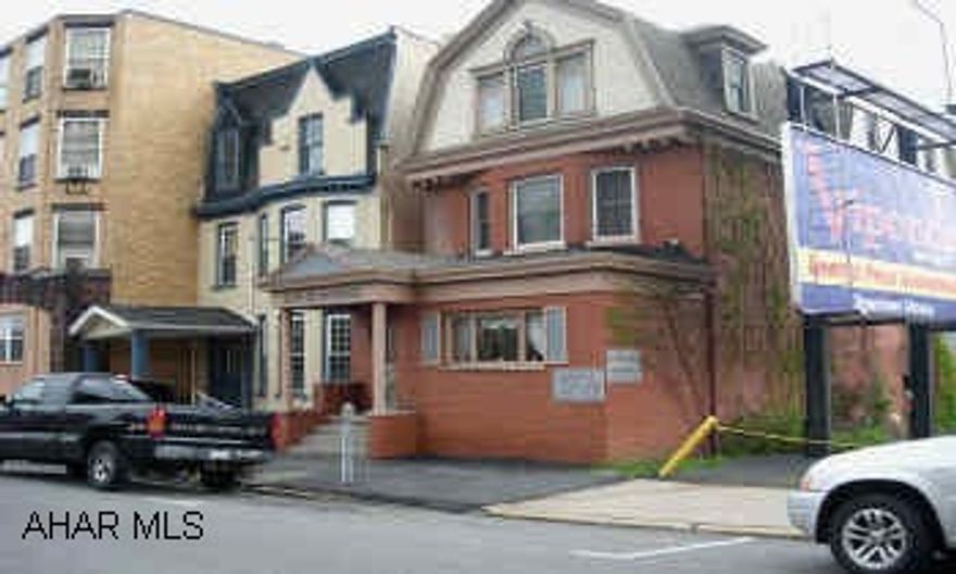 3 STORY WITH BUSINESS 1ST FLOOR, 2 ADDITIONAL APARTMENTS ABOVE. WELL KEPT PROPERTY WITH CURB APPEAL, 1ST FLOOR OFFICES, 2 ADDITIONAL APARTMENTS ABOVE.  EACH UNIT HAS LARGE CLOSETS AND LARGE ROOMS.