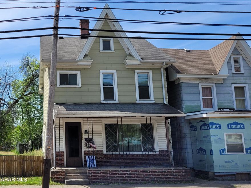 2 1/2 story, 3 bedroom home with 2 car detached garage. Sale includes house plus adjoining 50' x 180' lot.