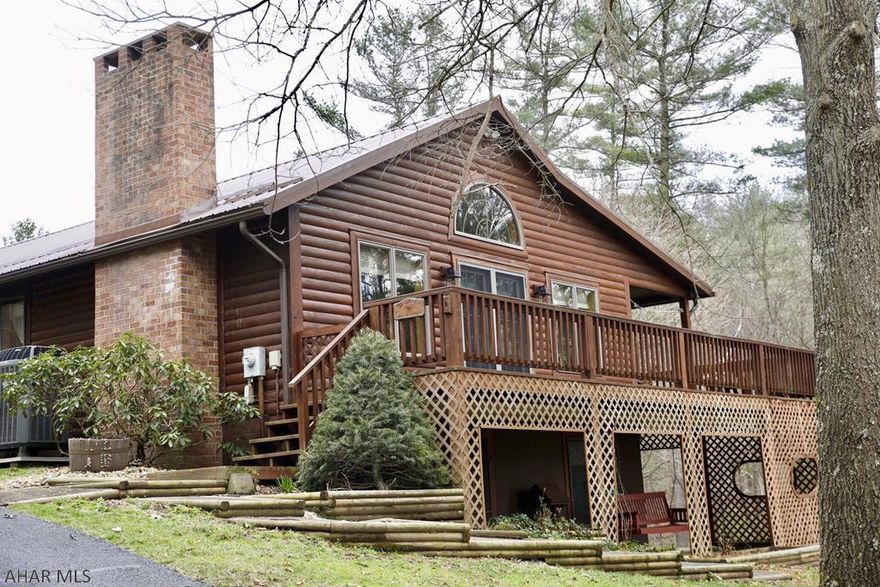 Log Home lovingly designed by Sellers. Sits on appx. 77 acres abundant with wildlife, fruit trees, grape arbors and blueberry bushes. Relaxing streams ambling through, 1 has a picnic pavilion w/fireplace for relaxing. 2 sided wraparound deck and walk-out bsmt patio. Paved circular driveway, 2 car attached 28X28 garage. Walk inside to the open flow living room w/stone fireplace, dining area and designer kitchen with plenty of oak cabinet storage. Main floor master bedroom w/full bath. 2nd Bedroom above garage, plus attic storage. 1/2 bath and laundry area complete the main floor. Bsmt fully finished with family room, 2nd kitchen,3rd bedroom and 3/4 bath. Very close to State Game Lands!