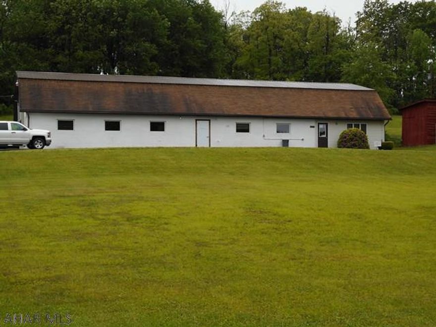 Garage area with 16' ceiling height containing 2800 sq ft with work area. Township rents one room on monthly basis. Great building including lift, three phase electric and soft coal furnace. Located at the entrance to Rock Run Recreation Area. Call for details. Can include hose business, currently in operation, at a total price of $190,000. Owner will stay on to teach business or work it.  Great opportunity to own your own business. With the location at the entrance to Rock Run would be great location for atv sales or repair, ect.