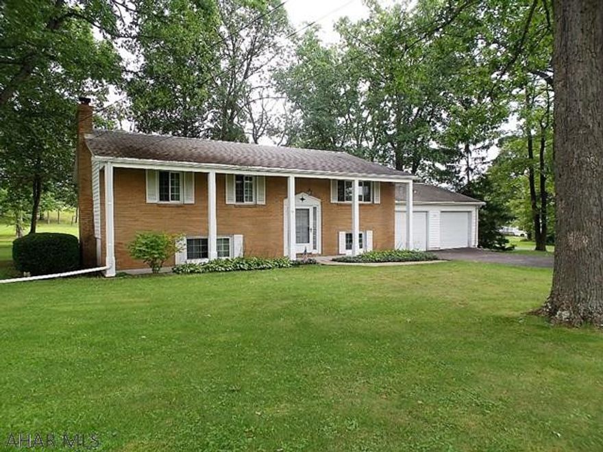 Bellwood bi-level on over an acre.  3 bedrooms, 1.5 baths, hardwood floors.  This home offers so much potential with the spacious rooms and lower level family room, possible 4th bedroom and workshop area.  It also offers an oversized 2 car attached garage.  The lot backs to pasture and is flat with mature trees.  With some updating, you can bring this back to a premier Tipton home!