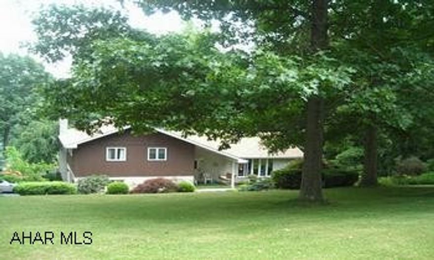 SECLUDED SPLIT ON 1.6 ACRES AND JUST MINUTES FROM BEDFORD!!THIS ONE OWNER HOME HAS BEEN LOVINGLY MAINTAINED AND IMPROVED BOASTING QUALITY THROUGHOUT!  THE EAT-IN KITCHEN IS A DELIGHT WITH GRANITE COUNTERTOPS, BEAUTIFUL WOOD CABINETS, DOUBLE OVENS, STOVE TOP ON ISLAND, DEEP SINKS, 2 PANTRYS AND EXITS TO A DECK OVERLOOKING THE PARK-LIKE BACKYARD!  SPACIOUS LIVINGROOM , DINING ROOM AND OPEN FOYER COMPLETE THE MAIN LEVEL.  THERE IS LOADS OF ROOM IN THE  MASTER SUITE WITH AN ADORABLE SITTING AREA, BATH, AND WALK-IN CLOSETS!  THE COMFORTABLE FAMILY ROOM OFFERS A THERMOSTATICALLY CONTROLLED FIREPLACE WITH FAN PLUS IT IS READY FOR A WET BAR!  THE LOWER LEVEL IS ADDITIONAL LIVING SPACE AND COZY WITH A WOODBURNING STOVE!  ADDITIONAL FEATURES INCLUDE LOADS OF STORAGE, 307' FRONTAGE, ANDERSEN WINDOWS, PERENNIALS, ORCHARD, CENTRAL AIR  AND RECENT IMPROVEMENTS OF A SAND MOUND SYSTEM, H/W TANK, INSULATED GARAGE  DOORS, AND ROOF.