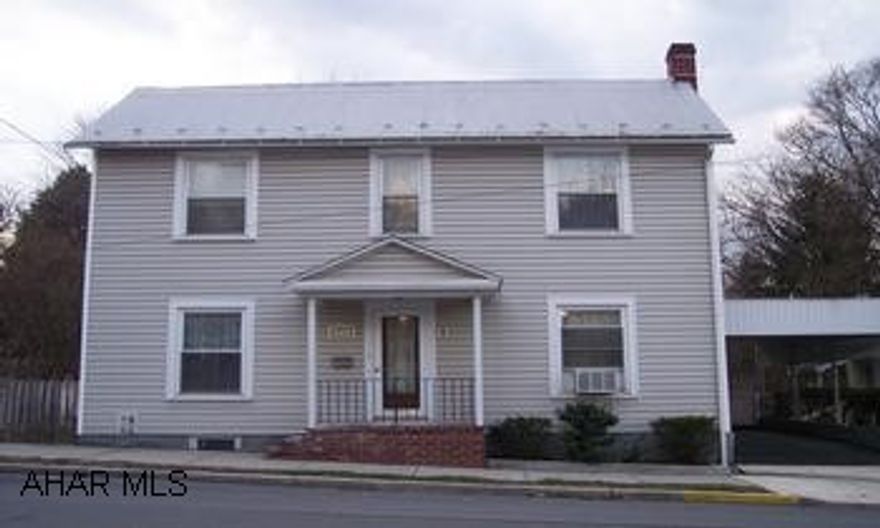two story vinyl sided with replacement windows, gas fireplace, cherry kitchen, built-in china cabinet in dining room, first floor laundry room, two baths with one on first floor, and a shed