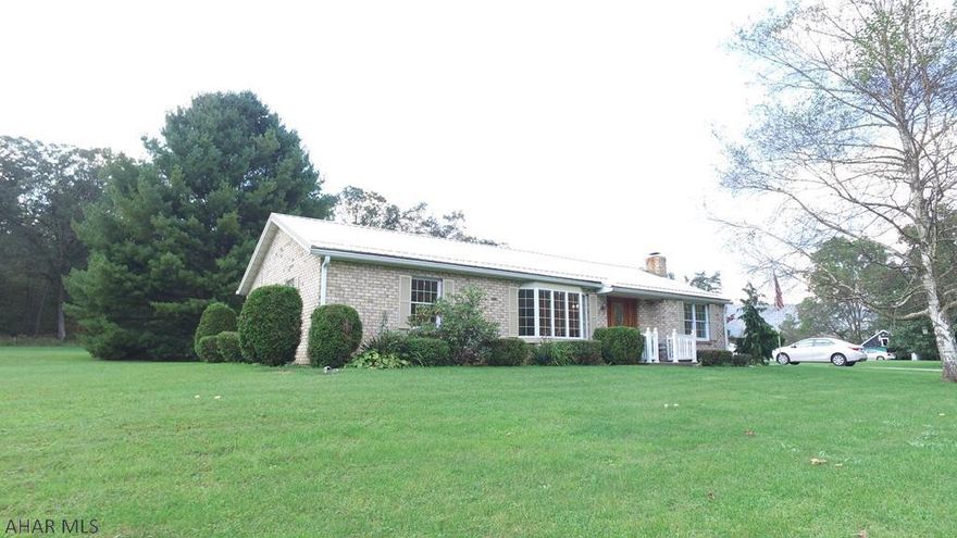This well maintained brick ranch offers an abundance of natural light to flood the interior, with views of many mature trees on  the spacious 1 acre property.  Enjoy the convenience of main floor laundry,  3 bedrooms, one of which is being used as a dining room, large living room and separate family room, as well as a quaint sunroom.  This home boasts hardwood floors under all the carpets.  Other features include a large garage with the ability to park 4 vehicles in tandem, a 6 bay pole building, and storage shed.  This lovely home is centrally located between the historic town of Bedford and Cumberland, MD.