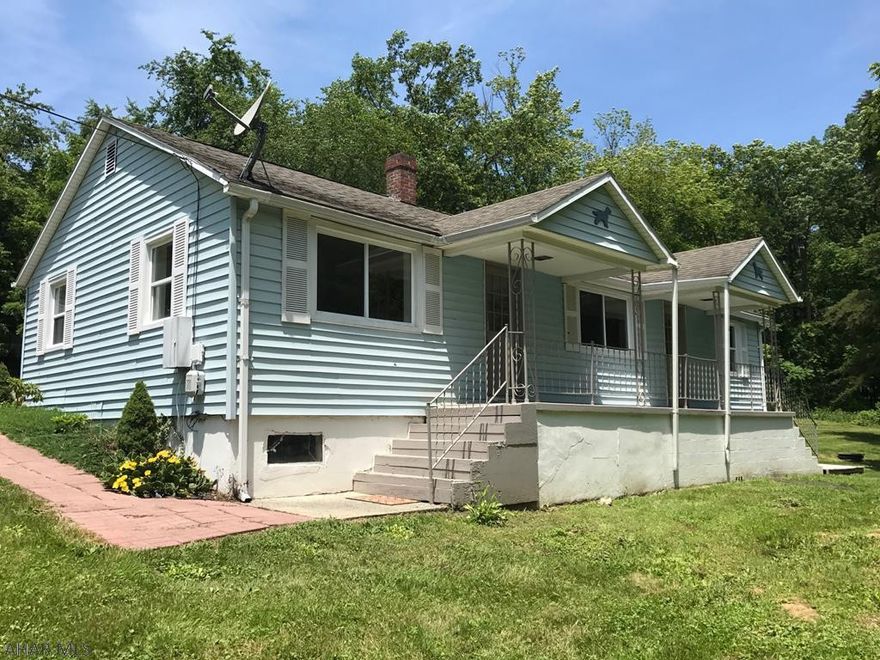 This ranch home has been freshly painted throughout and move-in ready!  Featuring a living room, three bedrooms, kitchen with eat-in area and a den/office.  Oak hardwood floors, double pane windows, and a nice covered front porch for relaxing.  Shingle roof is less than 10-years old, vinyl siding, oil forced air heat and 100-ampere electric.  Spacious yard, new gravel on the driveway and large one-car garage.  Ready for a new owner!