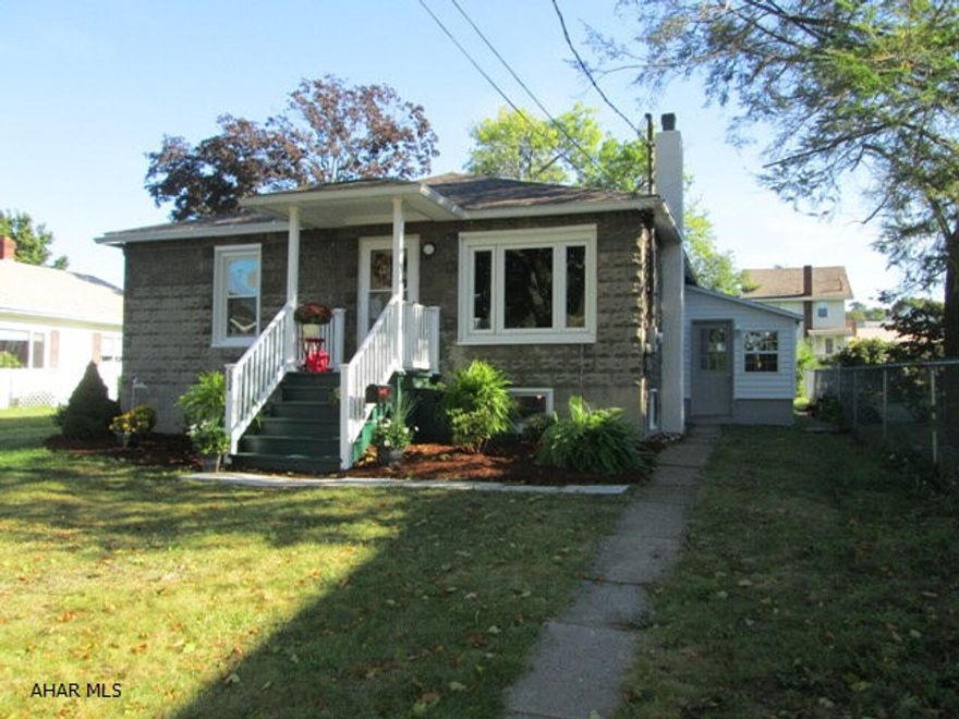 Altoona/Eldorado. Well built one story features updated kitchen, bath and updated mechanicals. Living room has brick fireplace with hardwood floors, the kitchen is spacious with eat in area, and there is a rear room for extra bedroom or man cave. The heated mud room could double as a computer area or game room. Basement is unfinished but is huge and could easily be finished for even more space. Rear off street parking with a nice deck.