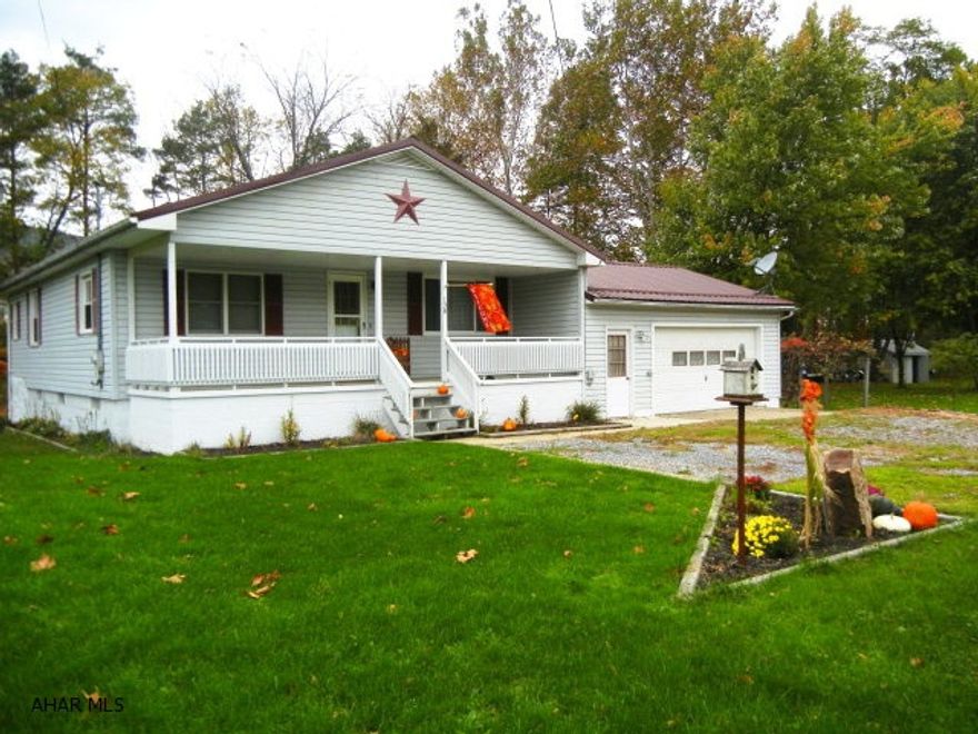 TIRED OF CITY LIVING??!! Make yourself at home in the  country-- mortgage payment (included taxes and all insurances) could be as low as $750.00 per month!!!) Contact agent for special financing. (SELLER WILLING TO RENT-- CALL AGENT FOR DETAILS  Just unpack and move right in.   Minutes from conveniences of town.  Relax or entertain on the large 16X21 rear deck facing the woods and stream, or you can picnic under covered pavillion.  Enjoy fires in the fire ring while playing horseshoes in the pit.   Nicely landscaped w perennials.  Large 2 car garage that is drywalled and heated and also offers storage above.  New metal roof on house & garage (2010), new hot water tank (2012)  Home is situated on almost 1/2 acre.  Taxes include $81.32 homestead.  Great price for what this home offers