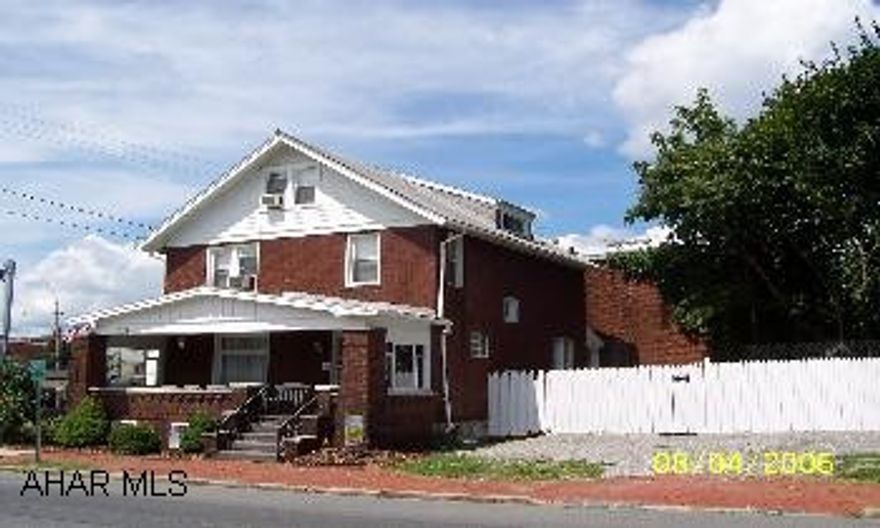 2 1/2 story brick - 5bdrs- hardwood floors. Convenient location - zoned resi or commercial. Great investment property.