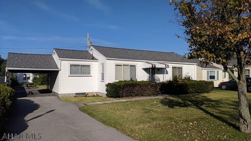 Beautiful Garden Heights 1 story vinyl home features eat-in kitchen, large living room, and first floor laundry. Thermo windows, central air, and 1 car carport.