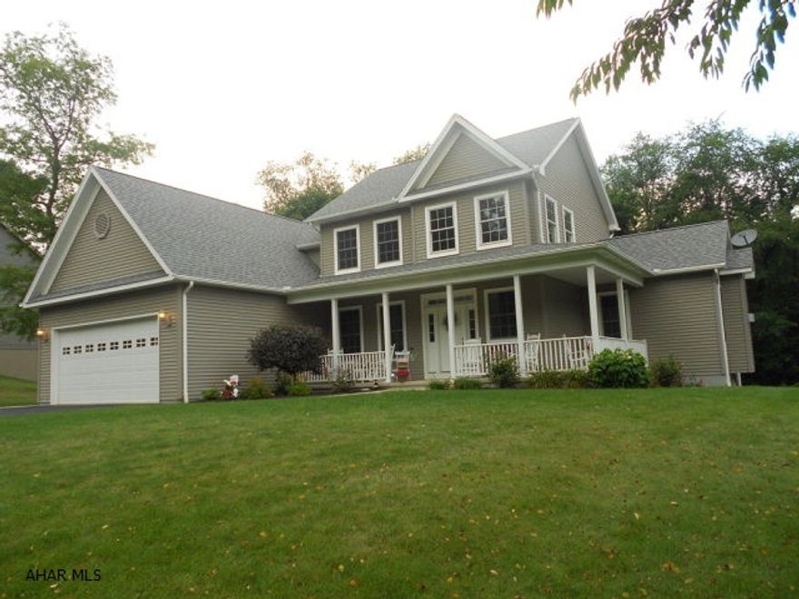 Wraparound front porch and rear composite deck, 2 car garage and a flat lot which backs up to Snake Spring Park. 4 bedrooms,5th one in the basement. Main level master bedroom with huge master bath, double sinks and garden tub with a tile/marble shower and walk in closest. Custom kitchen with center work island and cherry cabinets, tile floor, breakfast nook and wet bar. Inviting gas fireplace in the great room with hardwood floors. Formal dining with hardwood floors. Basement has been finished and has a full bath, extra bedroom, family room and exercise room, along with utility and storage room. 2nd story has 3 bedrooms and full bath. Lovely, easy care and quality built home! Call to see this one!