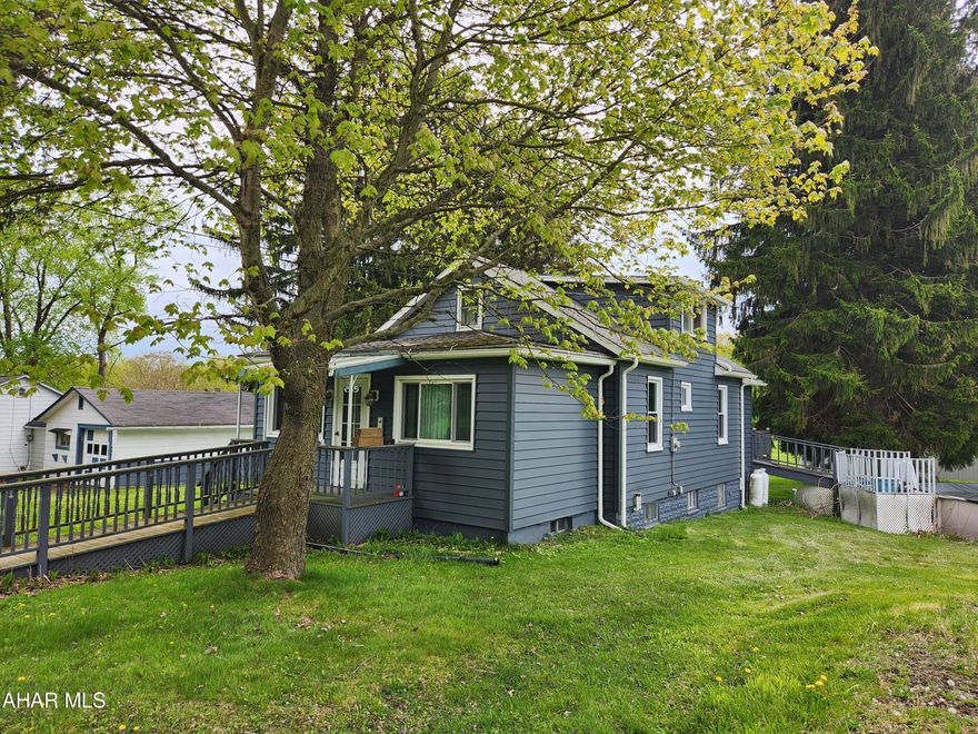 Chsrming 3 bedroom 1.75 bath bungalow on approximately  .68 acres and detached garage.
Features 1st floor main living. Has a huge flat yard ready for summer cookouts! Call to schedule your showing.