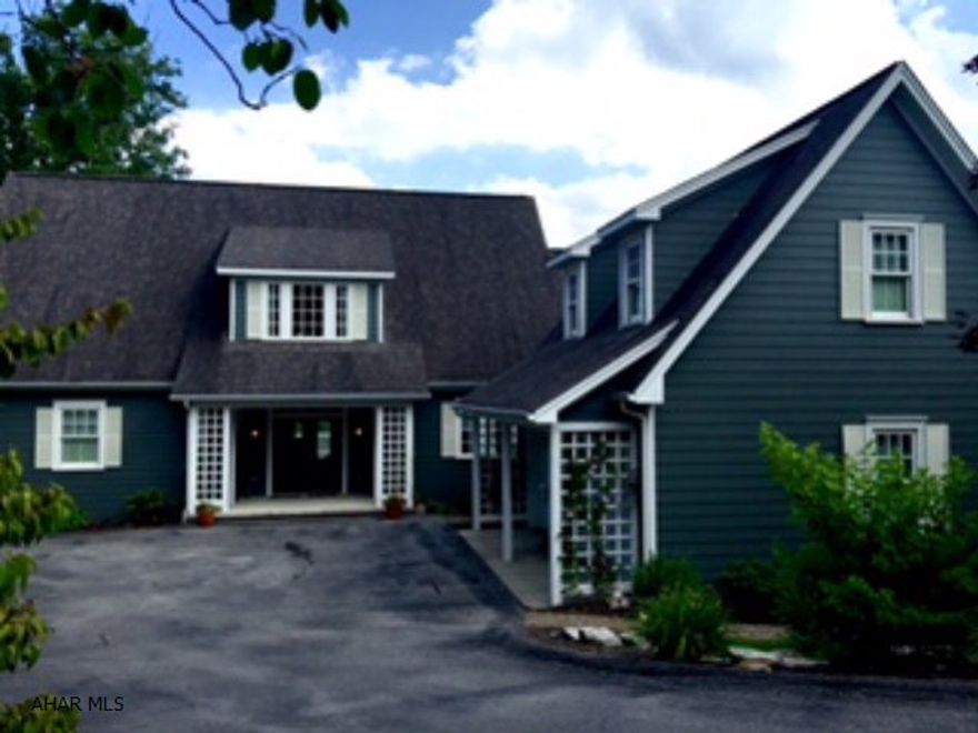 If you are looking for a LUXURIOUS, high end quality home, YOU JUST FOUND IT!! This property boasts with custom detailed features and amenities. Custom built by builder Sam McCloskey. Drive down a private driveway to this luxurious home nestled by woods with gorgeous perennials that creates a serene aura and tranquil atmosphere of privacy. It's the perfect home for entertaining with a custom Kitchen open to the Dining Room and Living Room. Entertain on the large deck off the Living Room, screened in porch off the Dining Room, cement patio off the Family Room. What a wonderful way to end your day in the large Master Bedroom with it's own Sitting Room, large walk-in closet, beautiful Master Bath and ALL ON THE FIRST FLOOR!! In a very convenient location across from the Blairmont Country Club