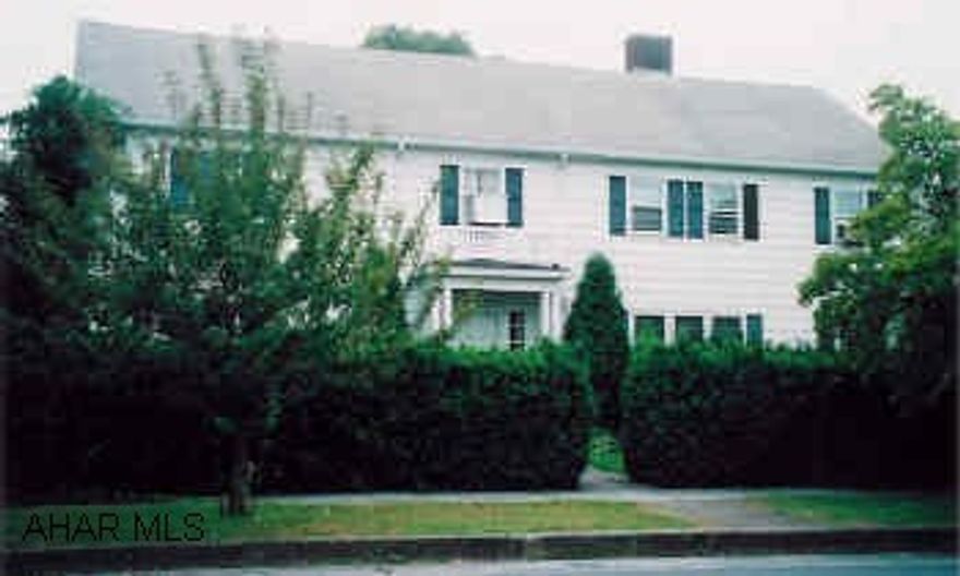 2-Story Traditional home in Everett, 4 car garage, 3 car carport, tennis court, large yard.Master bedroom has full bath and fireplace.  Beautiful front staircase, crystal chandlier in foyer. This is a must see home! Lots of space, extra features. Also two apartments on property to use for extra income. Home has security system.