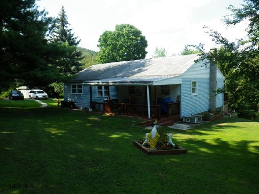 Country location! 3 BR ranch on almost an acre. Newer kitchen, enormous living room. Oil HW heat, shed, 2 decks