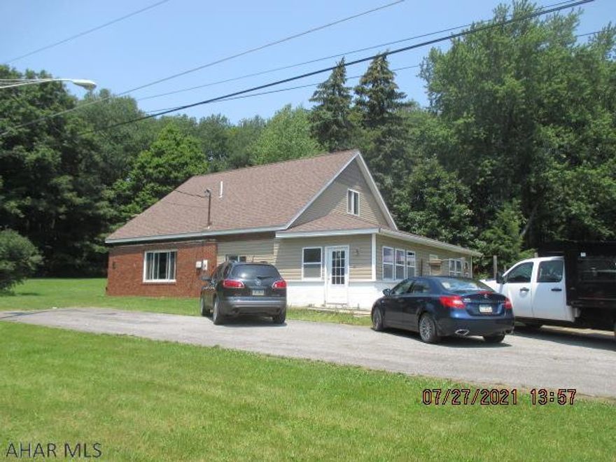 1.5 story home with many updates located on secluded 0.56 acre lot and features a 2+ bay garage with over sized doors, rear shop area, and overhead storage with walk up above the shop area.  Extra large enclosed porch in the front of the home that could be heated for additional living space.