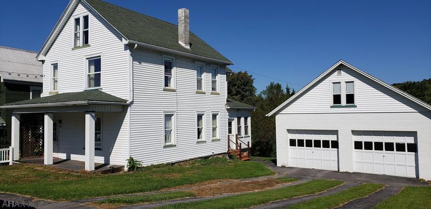 2 story home in a lovely neighborhood in Williamsburg. Property offers a garage with loft on 2 lots and additional buildings.  Oil heat with central air.  Replacement windows throughout.