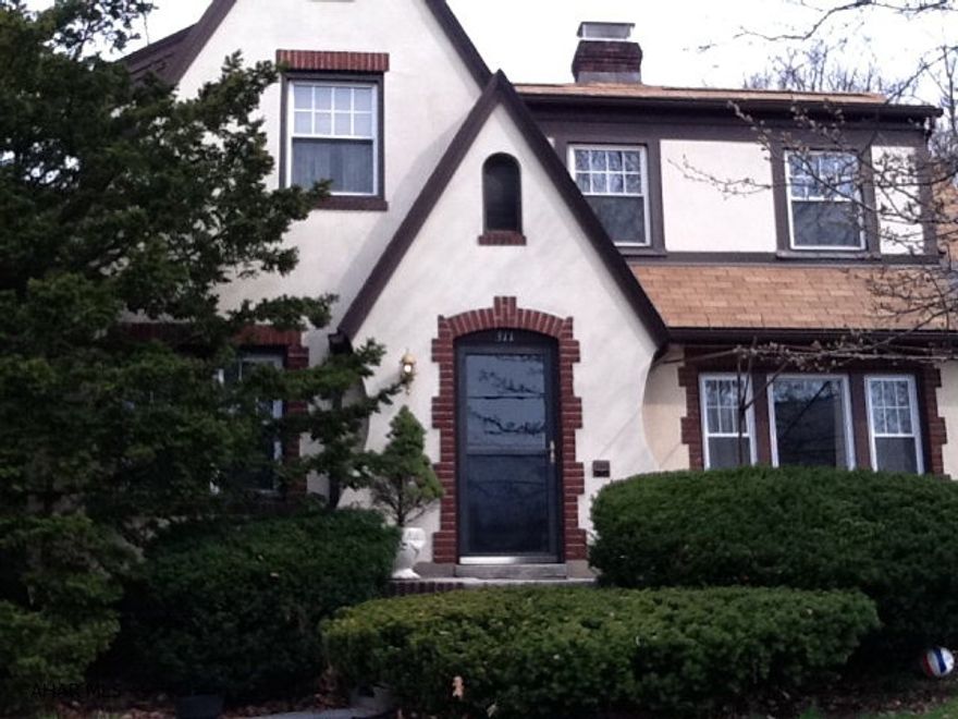 Charming 3 bedroom home with den and screened in porch, two car garage.