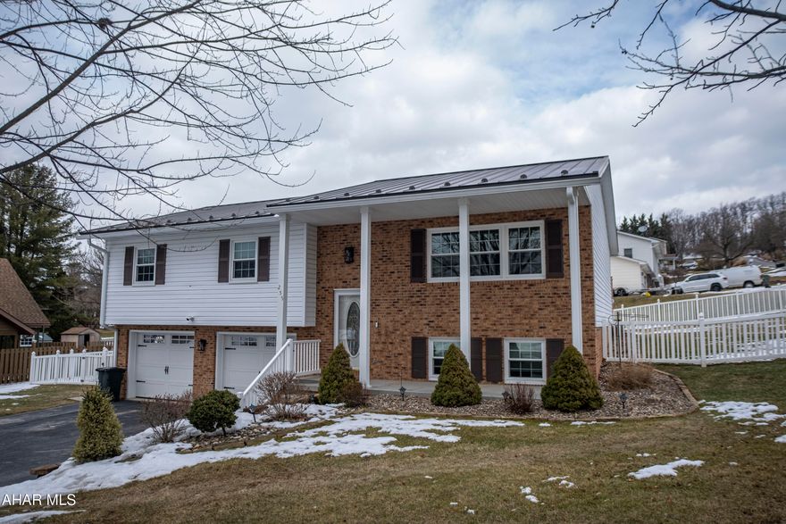 This beautifully maintained brick and vinyl home located in Rolling Hills offers comfortable living and fantastic outdoor space.. The well-designed layout features 3 bedrooms and 2.5 bathrooms.  The main level includes a nicely laid out and updated  kitchen, dining area and spacious living room which  are perfect for gatherings.  Also  a full bathroom, a master bedroom with an ensuite master bath with  two additional bedrooms. Downstairs, a large family room provides a relaxing space, along with a bonus room with a closet that could easily serve as a fourth bedroom, a convenient half bath, and a laundry room.  A desirable integral 2-car garage offers protection from the elements and includes an extra storage room for added convenience. Outside, is a meticulously landscaped, fenced yard .. The large back deck, complete with a built-in fire pit, is ideal for entertaining friends and family or simply enjoying quiet evenings. This  home truly has it all! Schedule a tour !