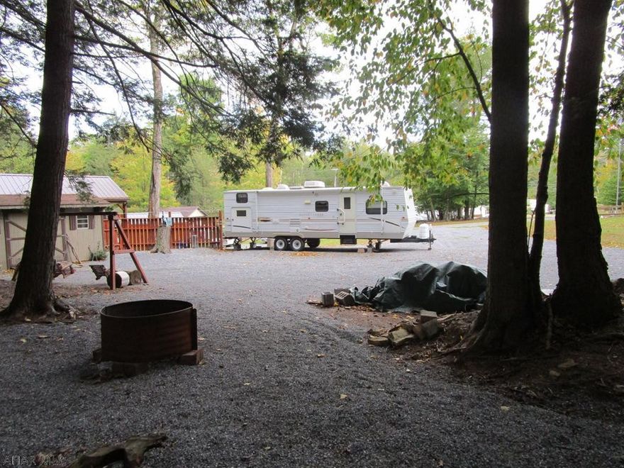 Hard to find double, private campsites in Glendale Yearound.  Adjacent sites give you extra room for your camper, parking and family to enjoy.  One lot has 100A. service for that newer, larger camper.  The second lot has a 30A box.   The back of the lots border the edge of Glendale Yearound providing additional privacy behind you.  Listing is to sell the campsites with shed only.  Seller currently has his camper and boat parked on the sites.  Seller would consider selling camper - make an offer if interested.  Located in Glendale Yearound, a gated recreational community adjacent to Prince Gallitzin State Park / Glendale Lake.  Near State Game Lands 108 and six miles from Rock Run ATV Park.