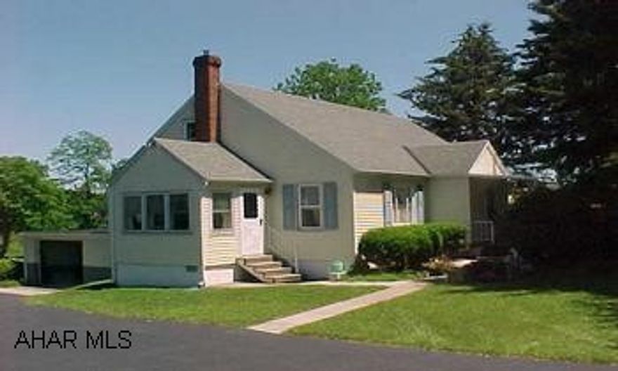 Nice 4 bedroom Cape Cod. Large eat-in kitchen, hardwood floors under carpet. Newer roof, windows and new furnace. Nice side sun porch, great lot.