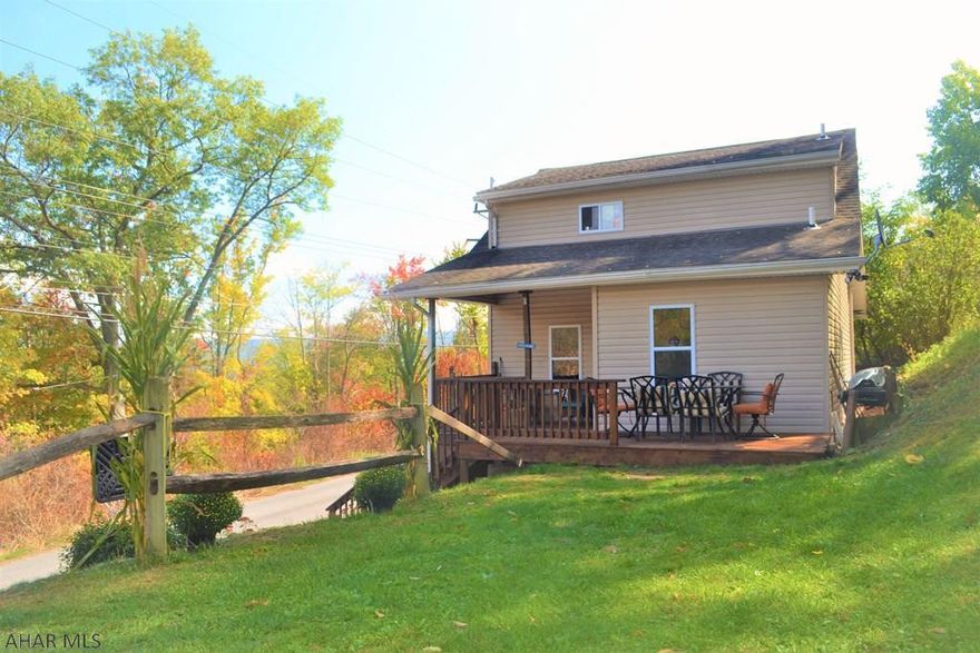 TUCKED IN TWO-STORY! This 3 BR, 1.5 BA home sits in a peaceful & private setting, but still close to everything.  First floor is updated throughout, has hardwood & ceramic tile floors and is bright & open.  You will find a mudroom, half bath, kitchen, dining room (with the BEST colorful views this time of year), as well as a large living room area.  Upstairs are the 3 bedrooms and a full bath. The basement has PLENTY of storage, as well as washer/dryer (they stay!) & newer mechanicals. The back deck & yard offer privacy as home is on a practically dead-end street. If you want charming & cozy but modern & updated too, this is your house! Walking distance to PSU Altoona. (On the note of privacy - Google even has it wrong! If using "Maps" use the address 2721 1st St)