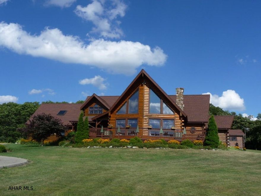 Beautifully custom designed, elegant log home was built in 1995 with spectacular views of the PA Allegany Mountains!! No corners missed on the exquist home built to perfection. Private 24.508 acre parcel with approx. 12 acres of wooded land. Features include cedar closet, cathedral and beamed ceilings, sky lights, ceramic and laminate FL, hot water dispenser, 16x24 picnic pavillion, central Vac, play house, shed, open firepit FP, 24x16 deck and Internet/wireless available.