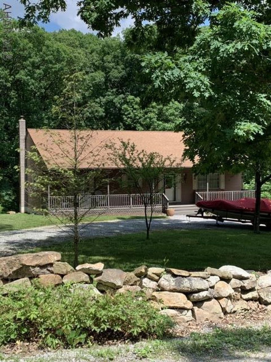 This easy maintenance & move in ready Ranch home on 1.78 acres within the sought after Lakeview Acres development is ready for its new owner.It is within short proximity to 4 public boat launches; AITCH,James Creek,Tatmun Run & Shy Beaver.It is also a short distance to 7 Points & Raystown Resort.The home is in a great location for a vacation home/year round living! An oversize 2 car insulated finish garage & the  rear storage area is ready for all your tools and toys.At the end of the day entertain your friends off the kitchen on the enclosed screened in deck with tiled floor.he outdoor area features a circular driveway,rock retaining wall,fire pit area, & seasonal creek.The front porch invites you to sit & enjoy the evening stars.Homes in this development do not come on the market often.