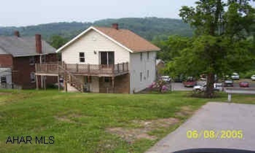 two story vinyl sided with 1 car garage, patio and deck off the back of the house the property has an oil FA furnace and a heat pump that works when the temp. is above 35 degrees.  The seller is willing to pay some of the buyers closing costs.