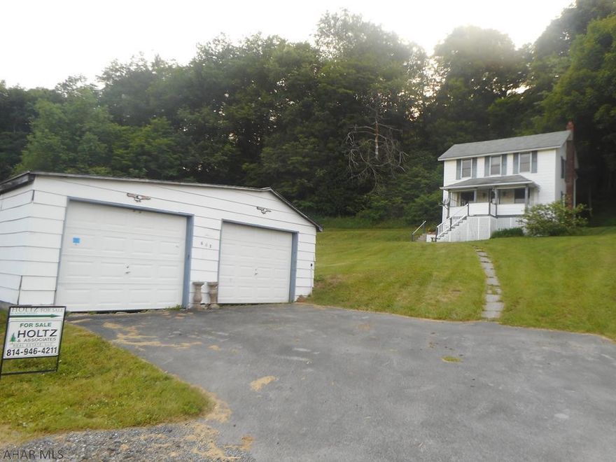 Partially remodeled two story home on a 1.08 acre lot. Vinyl sided with a nice front porch with view.  Home has newer carpet, upgraded appliances and hot water heat. Oil tanks are near full. Detached two car garage. Great value!