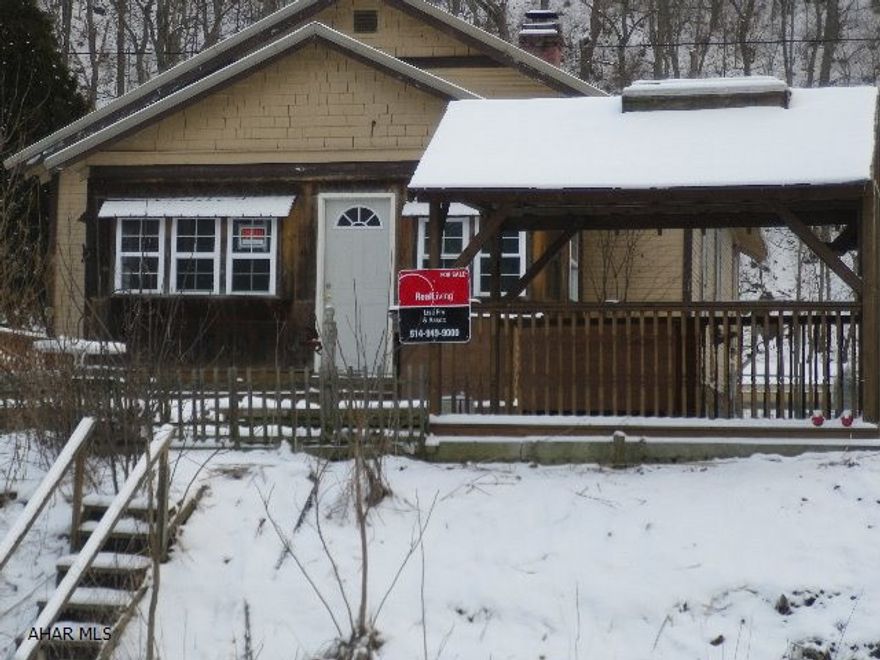 A dream for the hunter or fisherman.  Piney Creek is just over Wertz Rd at the end of this property.  Use for a weekend retreat or your permanent home.  The house needs some TLC.  The large shed & carport are included in the sale.  The small shed will be removed prior to closing.  A propane wall heater heats the enclosed front porch.  Septic is unknown.  Neighbors also use Claybaugh Lane to access their properties.  The property is being sold as is.  The seller is unable to make any repairs.