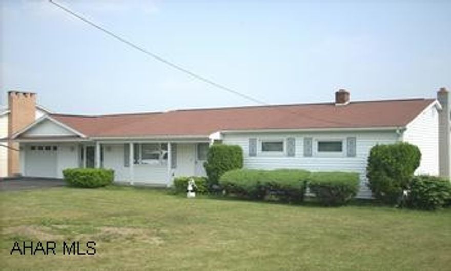 ONE STORY RANCH WITH ATTACHED GARAGE. LOVELY VIEWS FROM THE COVERED REAR PORCH OF THIS ONE STORY RANCH WITH ATTACHED GARAGE.  HARDWOOD FLOORS.  LARGE DINING ROOM.  PRETTY LOT.