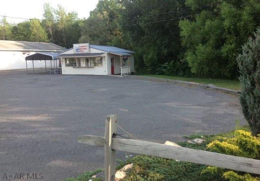 THIS PROPERTY CAN BE USED AS A CAR DEALERSHIP OR MANY OTHER USES.THERE IS A CURRENT BUSINESS OCCUPYING BUILDING CURRENTLY PAYING $800.00 MONTHLY. ALSO ANOTHER SMALL BUILDING WAS RENTED AT $300.00 A MONTH IS CURRENTLY VACANT.