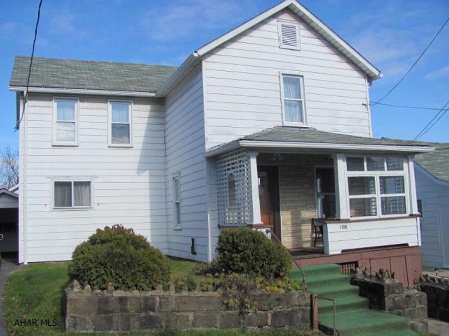 2 story aluminum sided 4 BR home on a 43 x 125 lot. Gas hot water radiator heat. 1 car detached garage & carport.