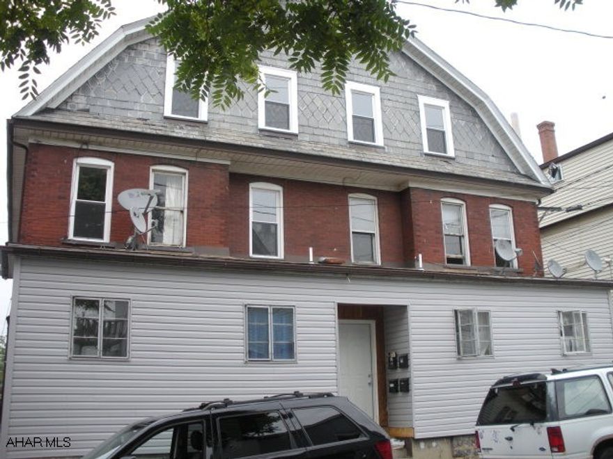 4 unit apartment building with great rental potential. Exterior is all brick with new vinyl enclosure in front, some new windows, & newer roof. Interior needs some TLC. All separate utilities. 1 unit occupied. Seller is motivated..bring offers!