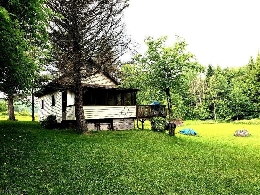 Great family getaway or hunting camp.  4.17 Acres furnished cabin with nice deck & access to Bob's Creek on property.  Open floor plan, drilled well with running water, no septic.  Approx 10 minutes to Blue Knob Ski Resort.  Heat source is 2 portable electric heaters.  J-485