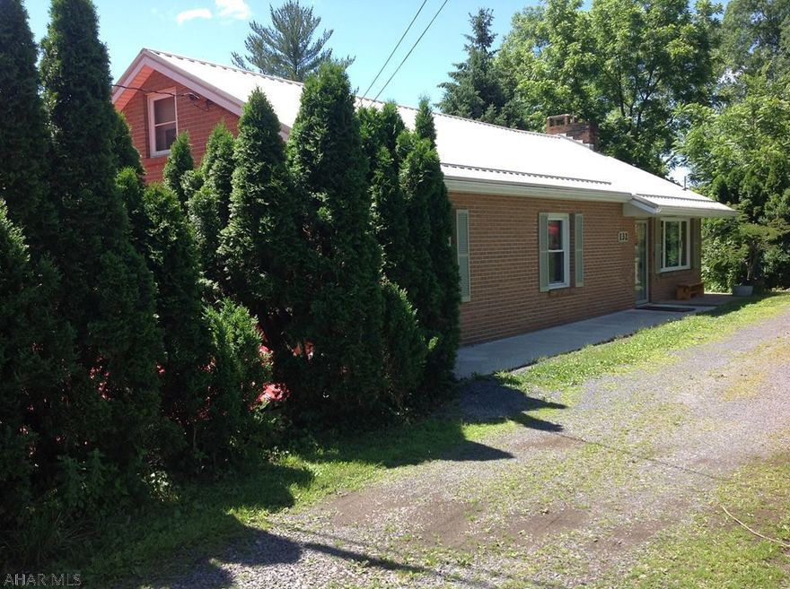 Fisherman's Dream!  This brick ranch offers 3 bedrooms, 2 oversized garage, beautiful hardwood floors and a fireplace in the living room.  Step out of your kitchen onto a deck overlooking a very well landscaped yard.  Situated on the Raystown Branch of the Juniata River.  Don't judge this property by doing a drive-by.  This is a MUST SEE property.