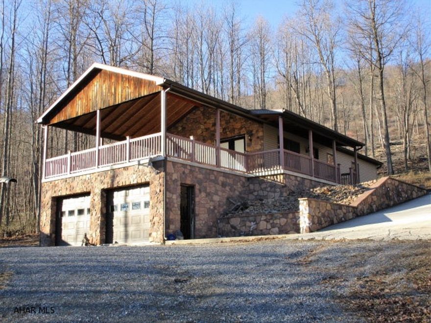 Check out this awesome mountain side home! Relax and enjoy the views from the huge covered porch. It offers a living room, with french doors to the porch, dining room, kitchen with a walk-out to the porch, two bedrooms, a full bath and a full master bath. Full unfinished basement with high ceilings and radiant floor heat. Heated two-car integral garage and detached two-car garage with radiant floor heat. Native stone retaining walls and native stone landscaping. Outdoor wood burning stove, four zone heating, central air-condition, well and sandmound. Short walk to State Forest Lands. Nice buy on this property!!