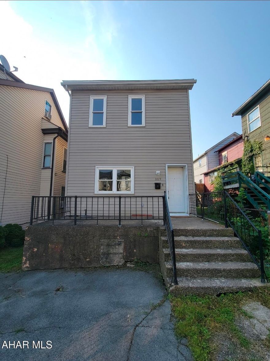 This  two-story home offers a thoughtful layout that maximizes every square inch of its footprint. The main level serves as the heart of the house, featuring a seamless flow between the inviting living room, a  dining area, and a kitchen, complemented by the modern convenience of a dedicated first-floor laundry room. Upstairs, you'll find three well-proportioned bedrooms and a centrally located full bathroom. The true standout feature is the walk-up finished attic, providing a versatile bonus space perfect for a quiet home office, a cozy media den, or a playroom tucked away from the main living areas. Schedule a tour.