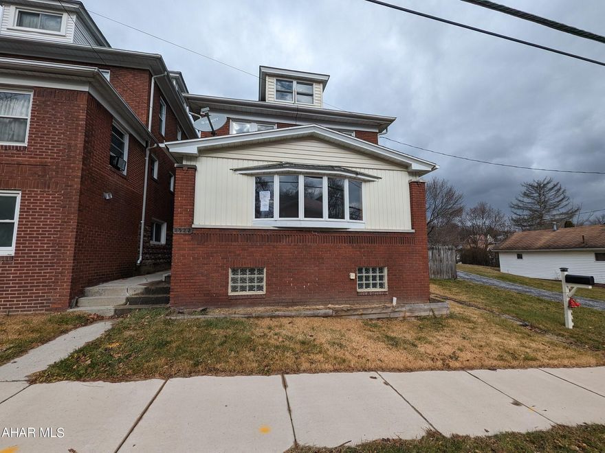 Altoona 2 .5 story brick home with beautiful formal living room and dining room w/ hardwood floors, updated kitchen plus enclosed front porch. Two bedrooms plus den/office/nursery and full bath w/ jet tub and stand-up shower. Finished attic, large rear wood deck, covered rear porch and off-street parking. Property sold AS-IS. Seller will make no repairs. Offers must be submitted through HUD approved broker. Buyer pays both transfer taxes. Exclusive Agency. Equal Housing Opportunity. www.HUDHomestore.com