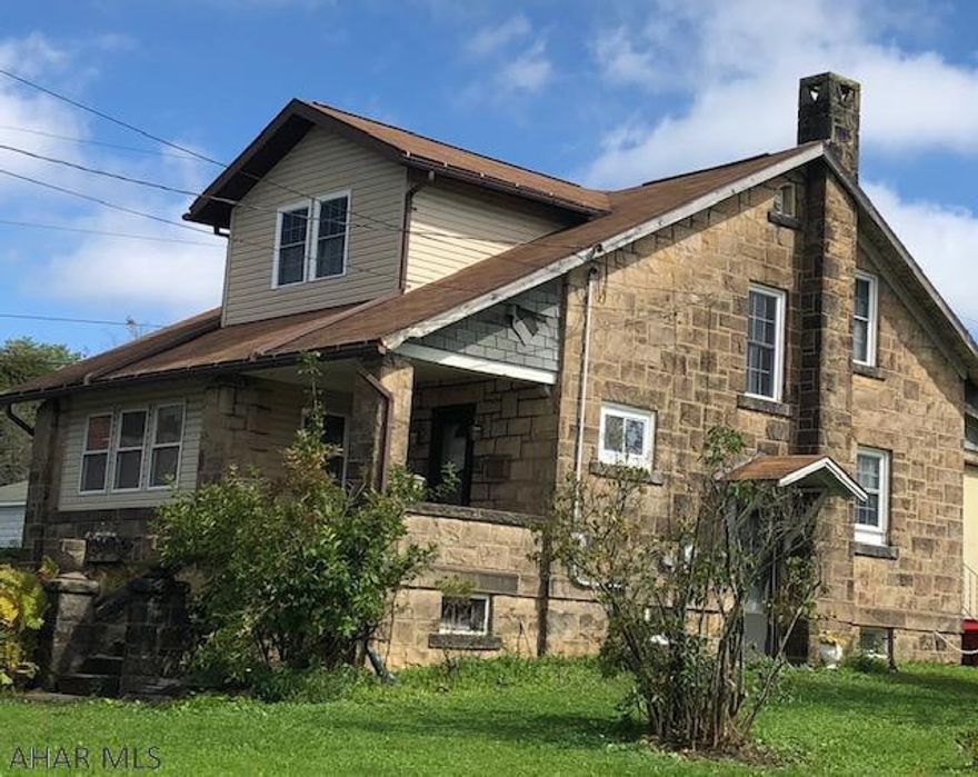 Beautiful stone house on large corner lot.  Large detached garage.  French doors, hardwood flooring.  Motivated seller, make an offer.