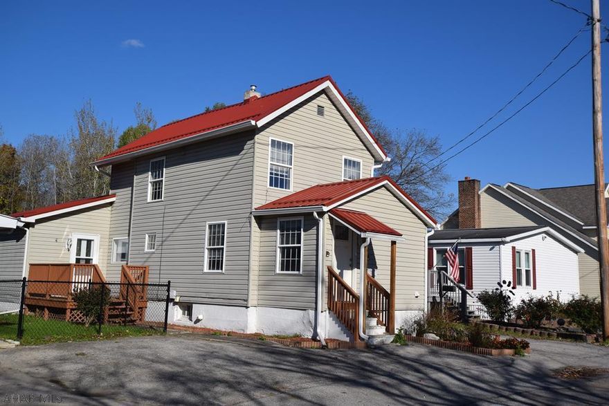 This cute home has been updated and could easily be made into one story living with the conversion of the family room into a master bedroom.  Updated kitchen with all newer appliances.  Bonus room inside back door could be mud room or den/office.   First floor laundry.  Newer carpeting recently steam cleaned for you.   Central air.    Large yard totally fenced in with newer black chain link fencing.  Off street parking for at least three vehicles.  Maintenance free exterior and new metal roof.   Move right in.