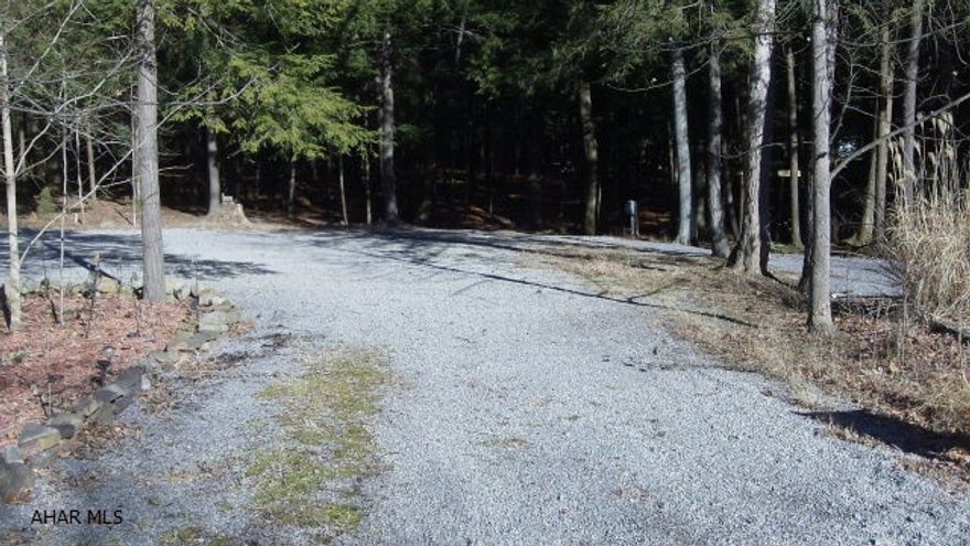 Two adjacent campsites nestled back against the woods and a stream running along the rear.  What better place could you ask for to place your camper and get back to nature?  Two lots gives you space and privacy.  An area has been landscaped for your fire ring and a shed is ready to hold your folding chairs or tools.  Utilities are on the lot.  Come for privacy and quiet or take part in the community activities in the development.  Swimming pool, tennis/basketball and volleyball courts along with horsehoes, playgrounds, pavilions, and athletic field offer something for everyone.  And don't forget Fido.  Glendale Yearound has Poochie Park for your best friend.  In addition, Glendale Yearound is adjacent to Prince Gallitzin State Park and Glendale Lake.  Only 6 miles to Rock Run ATV park.