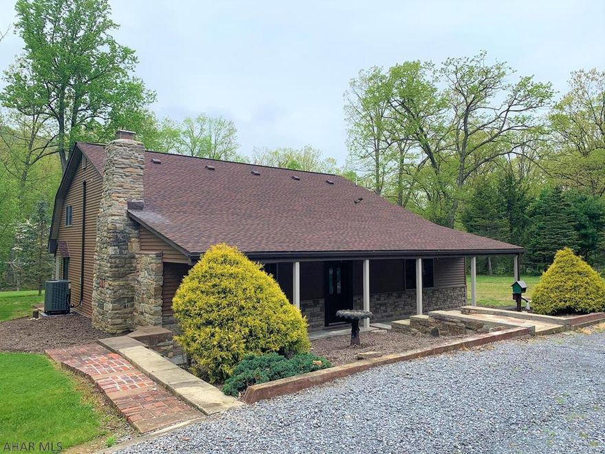 Captivating cape cod home nestled on a 1.52 acre tree lined lot. Renovated, remodeled, and move-in ready!! Main level offers a great room w/ vaulted ceiling & stone hearth wood fireplace, kitchen w/ new oak cabinets, stone back-splash & new s.s. appliances, sun room w/ heat & air, large finished bonus rm w/ laundry area, bedroom, & a full bath. Oak staircase w/ wood inlays leads to the 2nd level having a loft w/ multiple built-ins, hidden/secret storage area behind built-ins, huge master bedroom w/ cathedral ceiling, walk-in closet & en-suite m. bath, & another bedroom. Recessed lighting, 200-amp electric, "Trane" heat pump w/ central air, pvt well & public sewer. Thermo pane windows, architectural shingle roof, vinyl & stone siding. Sprawling front covered porch & stone and brick walks.