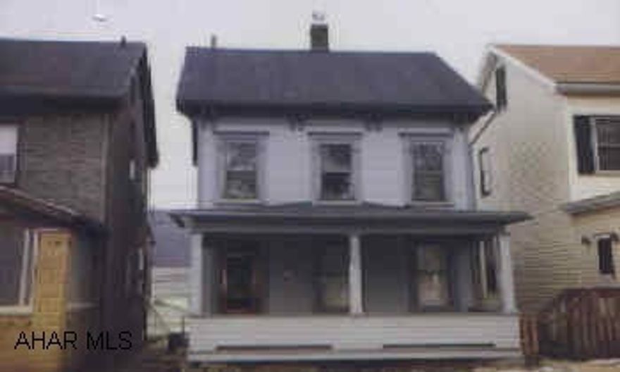 Remodeled kitchen, new ceramic floor on foyer and in bath, detached garage, central air, newer furnace, newer hot water tank.