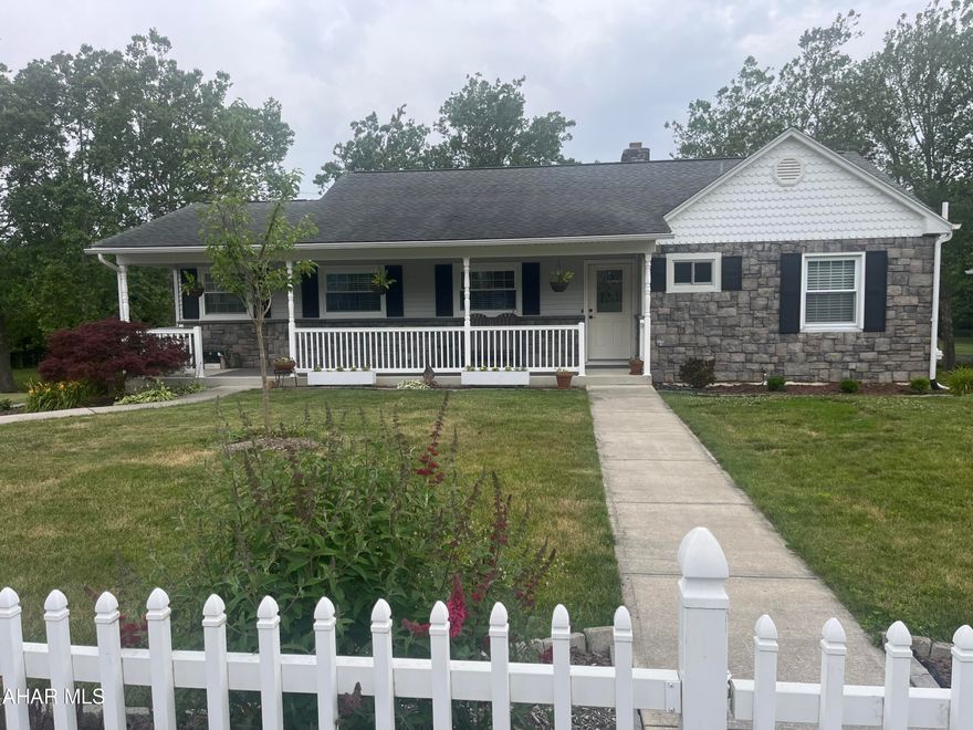 Step into this charming ranch home and feel the comfort of Home Sweet Home! Features a galley kitchen, overhead LED lighting, granite counters, oak cabinetry, pantry, luxury vinyl flooring adjoins dining area. Covered outside deck that overlooks the back yard and firepit area. Enjoy the large wall length windows while relaxing by the fireplace in the spacious living area. The downstairs features a family room, large laundry room, LED lighting, luxury flooring, storage room, mini split heating and cooling, fireplace, workout room/bedroom or a mother in law suite, full bathroom, mudroom, Radon mitigation system, 1 1/2 car garage with workbench and adjoining carport, whole house electronic air cleaner, whole house water filter, whole house charcoal filter, martin water drinking water system, high efficiency pellet stove (new), new shower enclosure, ceiling fans main level, new water main from curb to property (12/23). Beautifully landscaped and outdoor lighting! Paved driveway and stoned outdoor firepit area for your enjoyment. Close to schools and amenities. Call for your tour today!
