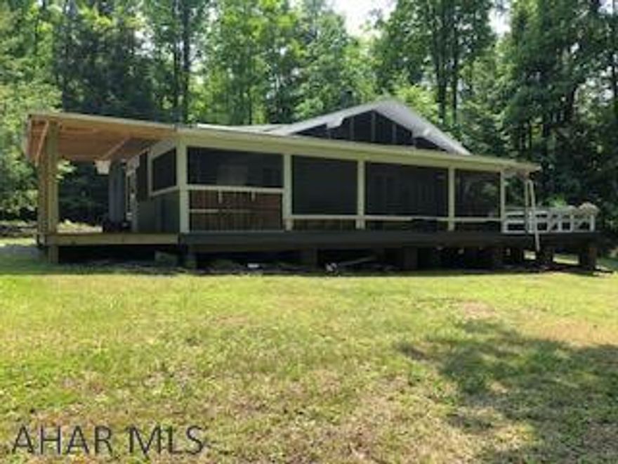 Year round home, summer cabin or hunting camp.Level 8.9 acres that abuts against approximate 1,0000 acres of State Game Land. Only 4 miles from Prince Gallitzin State Park. Large garage for boat storage. Includes a stable.