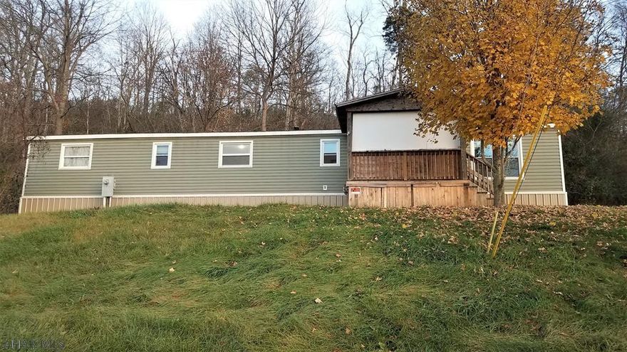 Are you an investor, first time home buyer or looking for a weekend gataway?  This afforadable property may be just what you're looking for.  This move in ready mobile home has been renovated and is ready for a new owner or a tenant.  It has updated, 200 amp electric, laminate and LVT flooring, and the paneling was replaced with drywall in all but one room.  It has been reinsulated underneath, has newer vinyl siding, insulated windows, a front covered porch and a rear deck.  This home is located close to Shawnee State Park, State Game Lands, Interstate 99 and the PA Turnpike making it the perfect base camp for hunting, fishing, biking, ATV riding or boating.  Come take a look, it may be the property for you.  Buyer to confirm square footage and acreage.