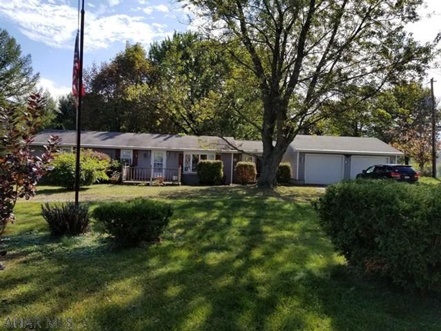 3 bedroom Ranch on a full foundation. Large bonus room that could be used as whatever you choose. With a total of 3 garage bays and a full basement there is no shortage of storage space.  A beautiful, flat yard in back with just over an acre of land. Come see if we can make this house your next home.